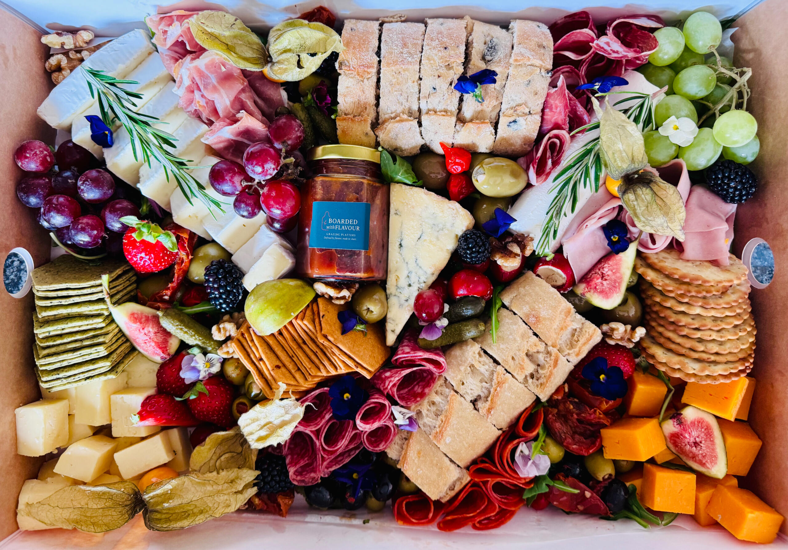 A Taster box with cheeses, fruit and meats